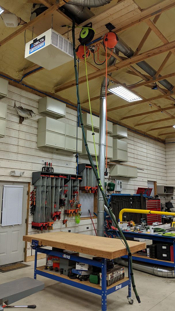 Anyone have retractable shop vac hose from ceiling?